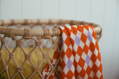 Check Mate Cherry Red with Lilac Speck | Swaddle