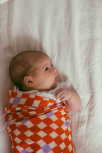 Check Mate Cherry Red with Lilac Speck | Swaddle
