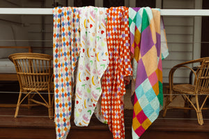Check Mate Cherry Red with Lilac Speck | Swaddle